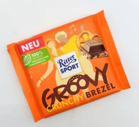 Товар Шоколад молочний Ritter Sport Groovy Crunchy Brezel Ріттер Спорт з кренделями та кукурудзяними пластівцями Плитка 100г