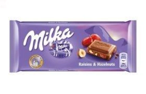 Молочний шоколад Milka мілка з родзинками та фундуком/milka raisin hazelnut 100 г.